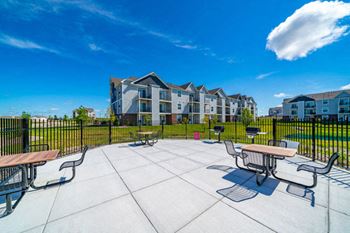 Nice grilling area with tables and chairs