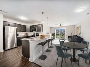 Elkhorn apartment for rent - an open kitchen and living room with a stainless steel appliances at Trade Winds Apartment Homes, Elkhorn, Nebraska