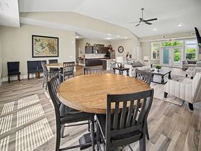 Elkhorn apartment for rent - A dining room with a wooden table and chairs at Trade Winds Apartment Homes, Elkhorn, NE, 68022