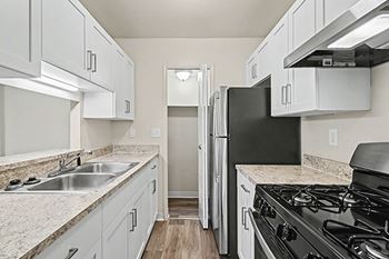 Galley-style kitchen with gas range