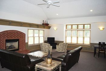 Community clubhouse with fireplace seating