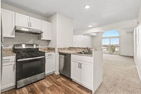 Elkhorn apartment for rent - A kitchen with white shaker cabinets and stainless steel appliancesnat West Hampton Park Apartment Homes, Nebraska, 68022