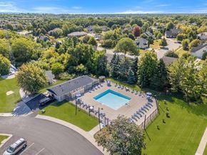 Kenosha apartment for rent - A bird's eye view of an apartment community with a swimming pool at Wood Creek Apartments, Wisconsin
