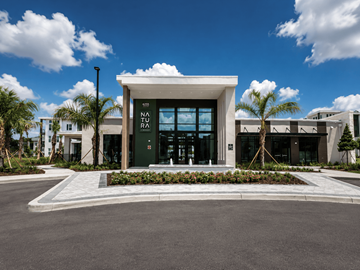 Gainesville apartment for rent - A modern building with a green sign that says NO PARKING.