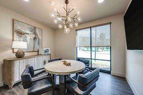Gainesville apartment for rent - A modern dining room with a round table and chairs.