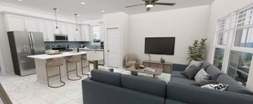 Alachua apartment for rent - A modern living room with a grey couch and a kitchen area in the background.