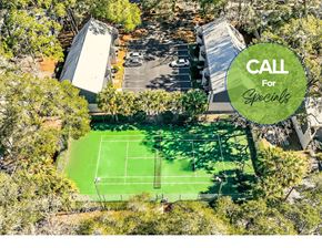 Gainesville townhouse for rent - a house with a tennis court in the middle of a forest
