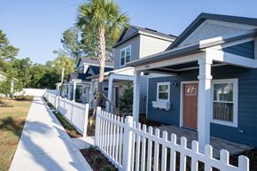 Gainesville apartment for rent - exterior of cottages with white picket fences