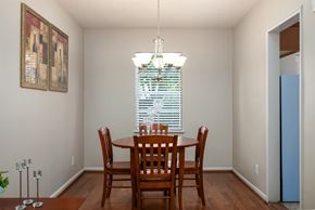 Mountain Brook apartment for rent - A dining room with a wooden table and chairs.