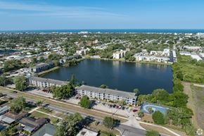 Largo apartment for rent - A large body of water is surrounded by buildings and a road.