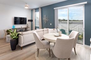 Apollo Beach townhouse for rent - A modern living room with a white sofa set and a flat screen TV.