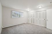 Oak Park apartment for rent - A room with white walls and a window with blinds.
