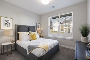 Grand Rapids apartment for rent - a bedroom with a large window and a bed