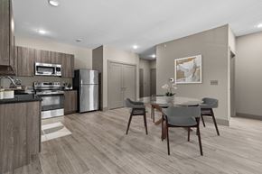 Holt apartment for rent - A modern kitchen with a dining table set for two.