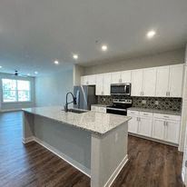Grand Rapids apartment for rent - a large kitchen with a marble counter top