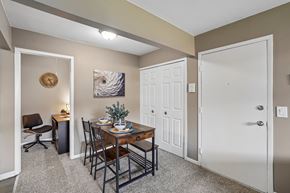 Brighton apartment for rent - A dining area with a table set for two and a painting on the wall.