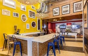 Ann Arbor apartment for rent - a bar with blue chairs at a restaurant with a pool table at Ann Arbor City Club, Ann Arbor, MI 48104