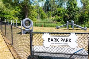 Lansing apartment for rent - a park with a playground and a bark park for residents only