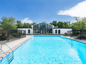 St. Louis apartment for rent - A swimming pool in front of a modern building.