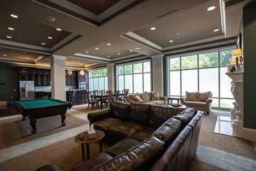 Gahanna apartment for rent - a large living room with a pool table and couches