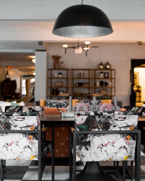 Detroit apartment for rent - a dining room filled with chairs and a table with masks on it