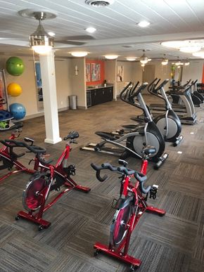 Indianapolis apartment for rent - a room full of bikes and weights in a gym