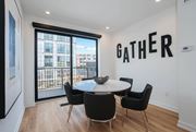 Detroit apartment for rent - a dining room with a table and chairs in front of a window