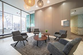 Detroit apartment for rent - a lounge area with chairs and a table