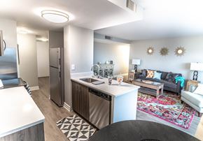 Detroit apartment for rent - a kitchen and living room with a refrigerator and a sink