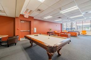 Springfield apartment for rent - a game room with a pool table and chairs