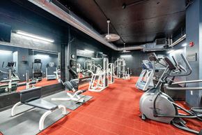 Springfield apartment for rent - a gym with various exercise equipment on the floor and a ceiling light