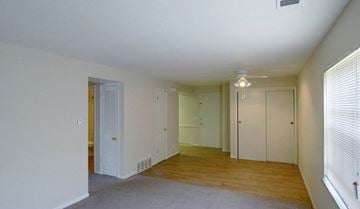 Columbus apartment for rent - an empty living room with white walls and a wood floor