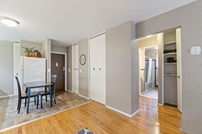 Royal Oak apartment for rent - a dining room with a table and a refrigerator
