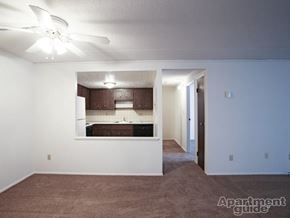 Elyria apartment for rent - Living area overlooking hallway and kitchen with ceiling fans