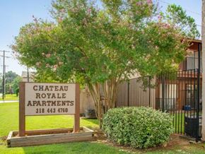 Alexandria apartment for rent - a chateau royale apartments sign in front of a tree