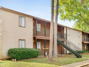 Alexandria apartment for rent - the exterior of an apartment building with trees and a staircase