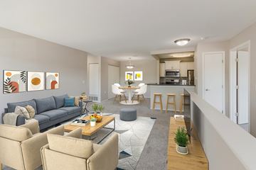 Grand Blanc apartment for rent - a living room and kitchen with couches and a table