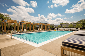Detroit apartment for rent - a swimming pool at a hotel with chairs around it at City Club Apartments Lafayette Park, Detroit