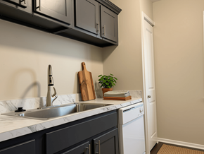 Waterford apartment for rent - A kitchen with a white sink and a white dishwasher.