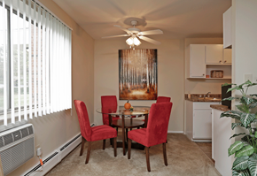 Richmond Heights apartment for rent - a dining room with a table and chairs and a ceiling fan