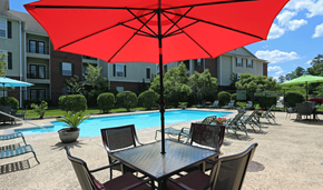 Lufkin apartment for rent - our apartments have a pool and a table with a red umbrella