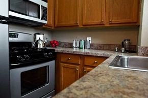 Detroit apartment for rent - Modern kitchen with stainless steel alliances.