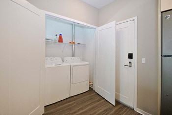A laundry room with a washer and dryer