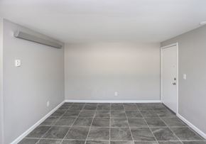 Indianapolis apartment for rent - A room with a sliding door and tile flooring.