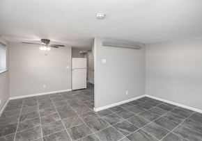 Indianapolis apartment for rent - A spacious room with tile flooring and a ceiling fan.