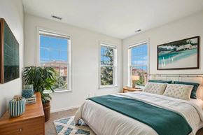 Troy apartment for rent - Bright bedroom with ocean artwork and teal bedding at Regents Club of Troy Apartments, Troy