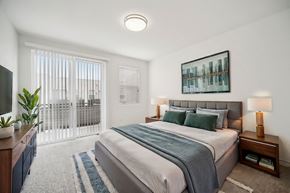 Ventura apartment for rent - A bedroom with a large bed and a television on the side table.