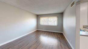 Inglewood apartment for rent - A room with wooden flooring and a window with blinds.