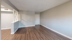 Inglewood apartment for rent - A room with wooden floors and white walls.