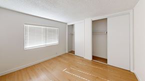 Ventura apartment for rent - A room with wooden floors and white walls.